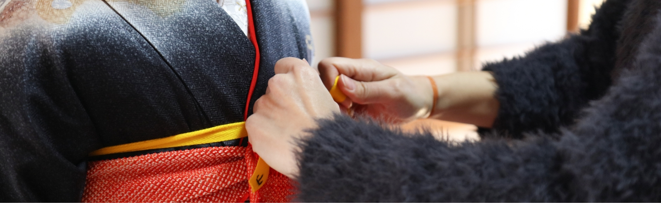 A tourist dons a kimono in Kyoto, Japan.