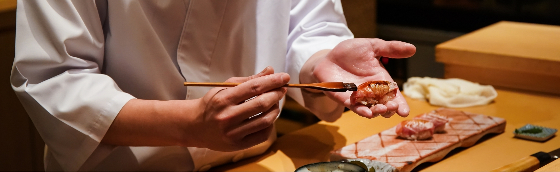 A chef preparing an omakase sushi.