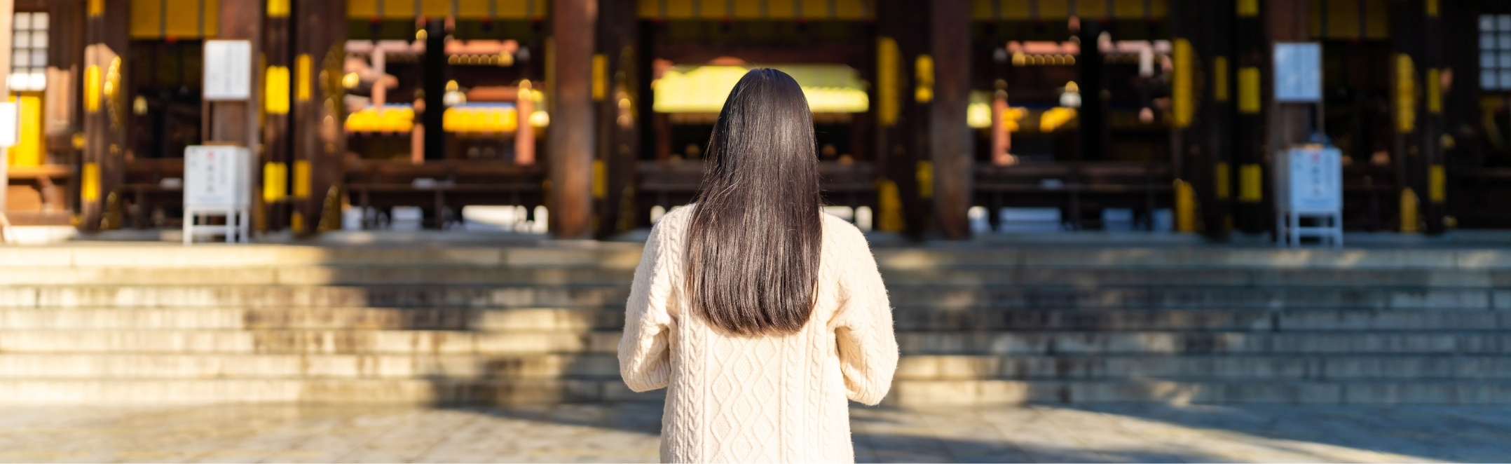 Saying a prayer at the Meiji Shrine in Shibuya, Tokyo, Japan.