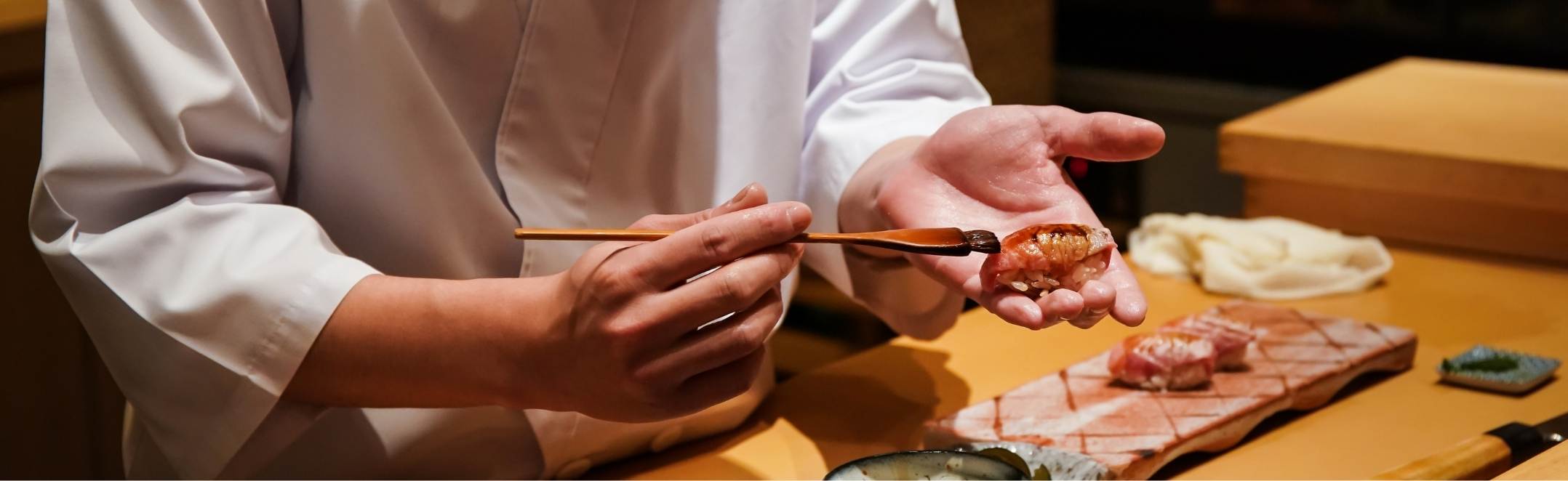 A chef preparing an omakase sushi in Japan.