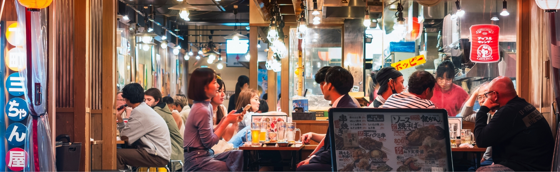Early crowd at an izakaya in Tokyo, Japan.
