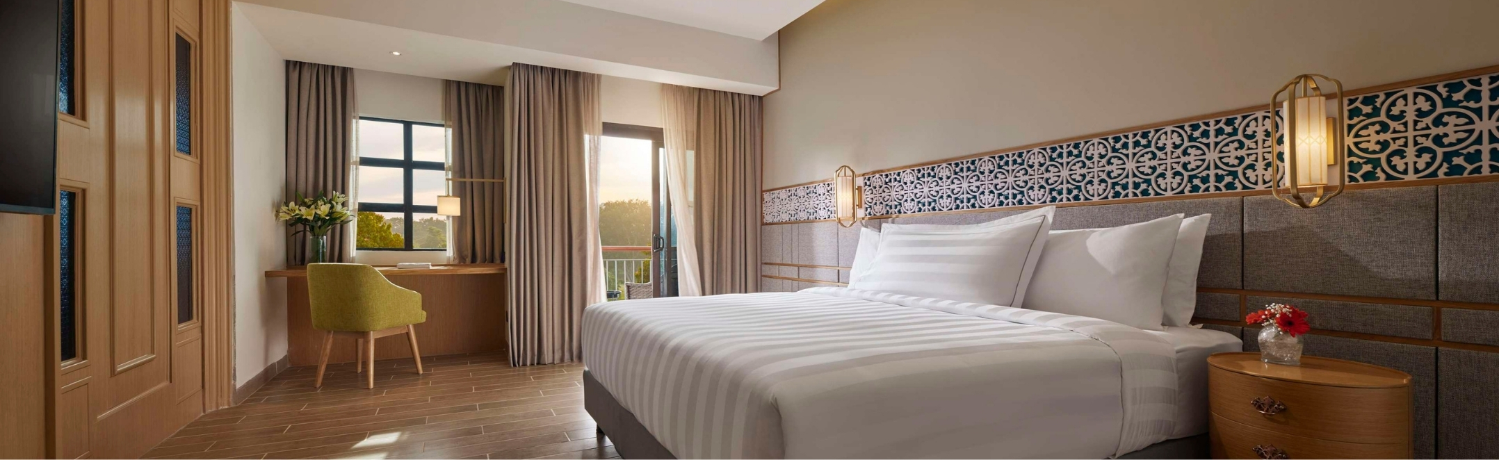 Sunset light bathes the spacious Premier Suite at PARKROYAL A'Famosa Melaka Resort, featuring Peranakan-inspired tilework.